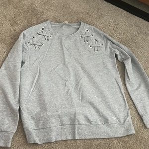Women’s gray Michael Korrs sweatshirt.